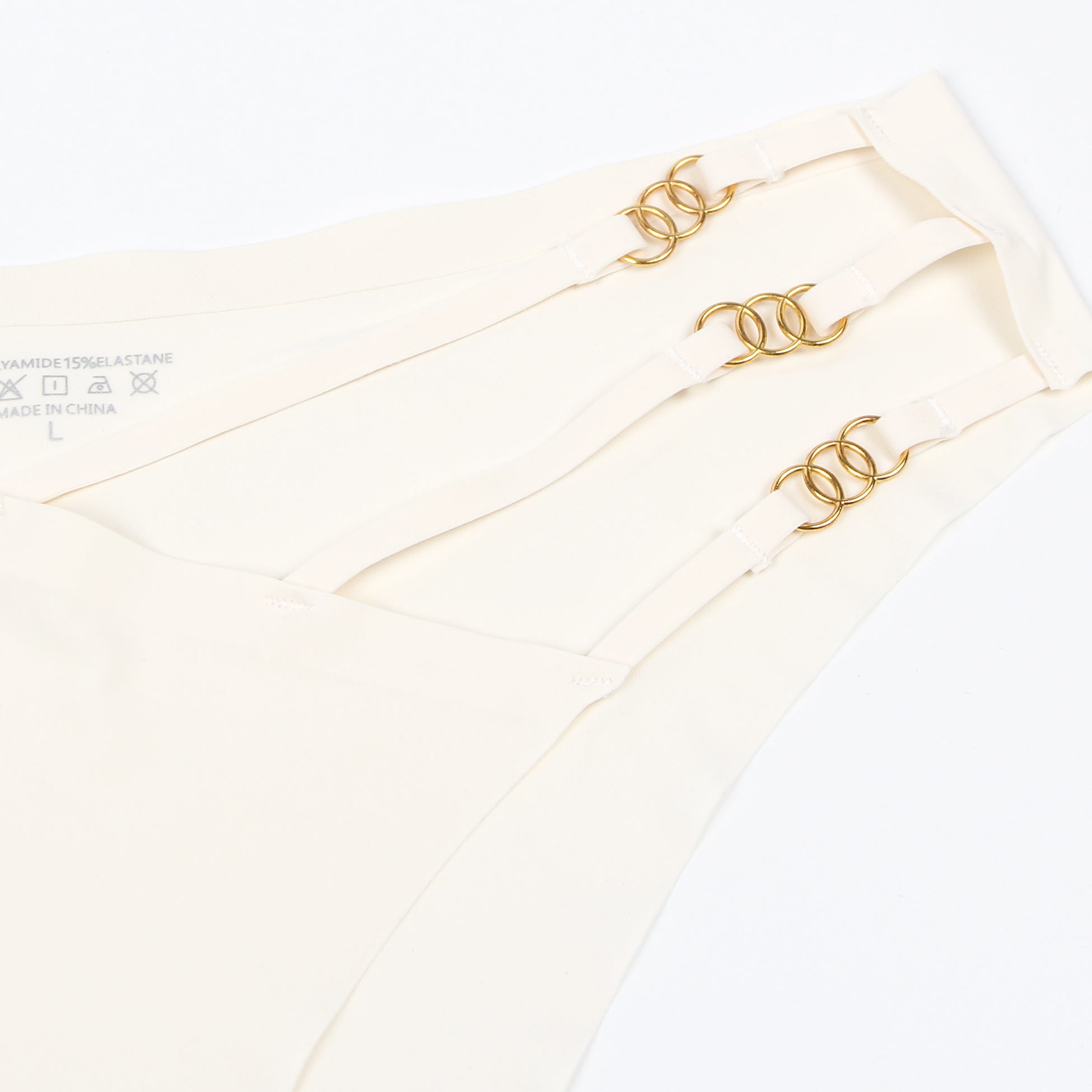 Beigefarbener, sexy, nahtloser Slip mit Schnallenverzierung