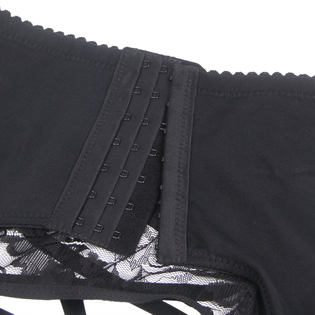 Close-up of black men's lace garter panty with hook and eye closure and floral lace detail